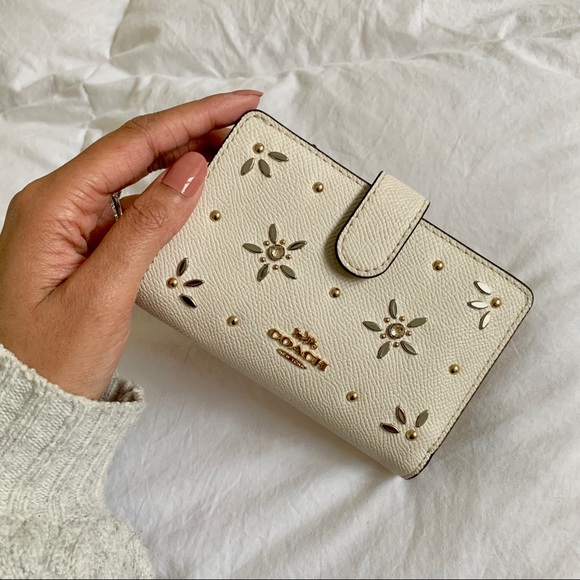 Coach cream compact wallet